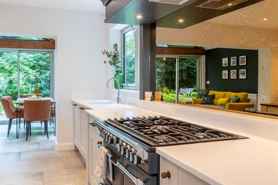 Range cooker with antique brass splashback