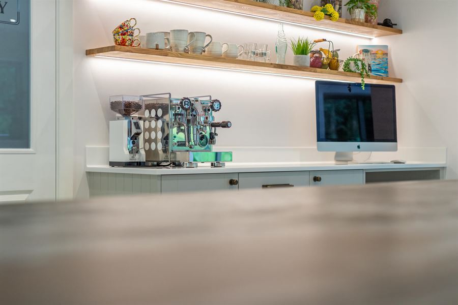 Desk area with shelving and grooved strip lighting