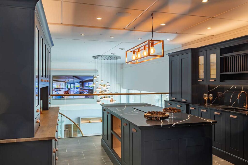 navy shaker kitchen display with black marble worktops