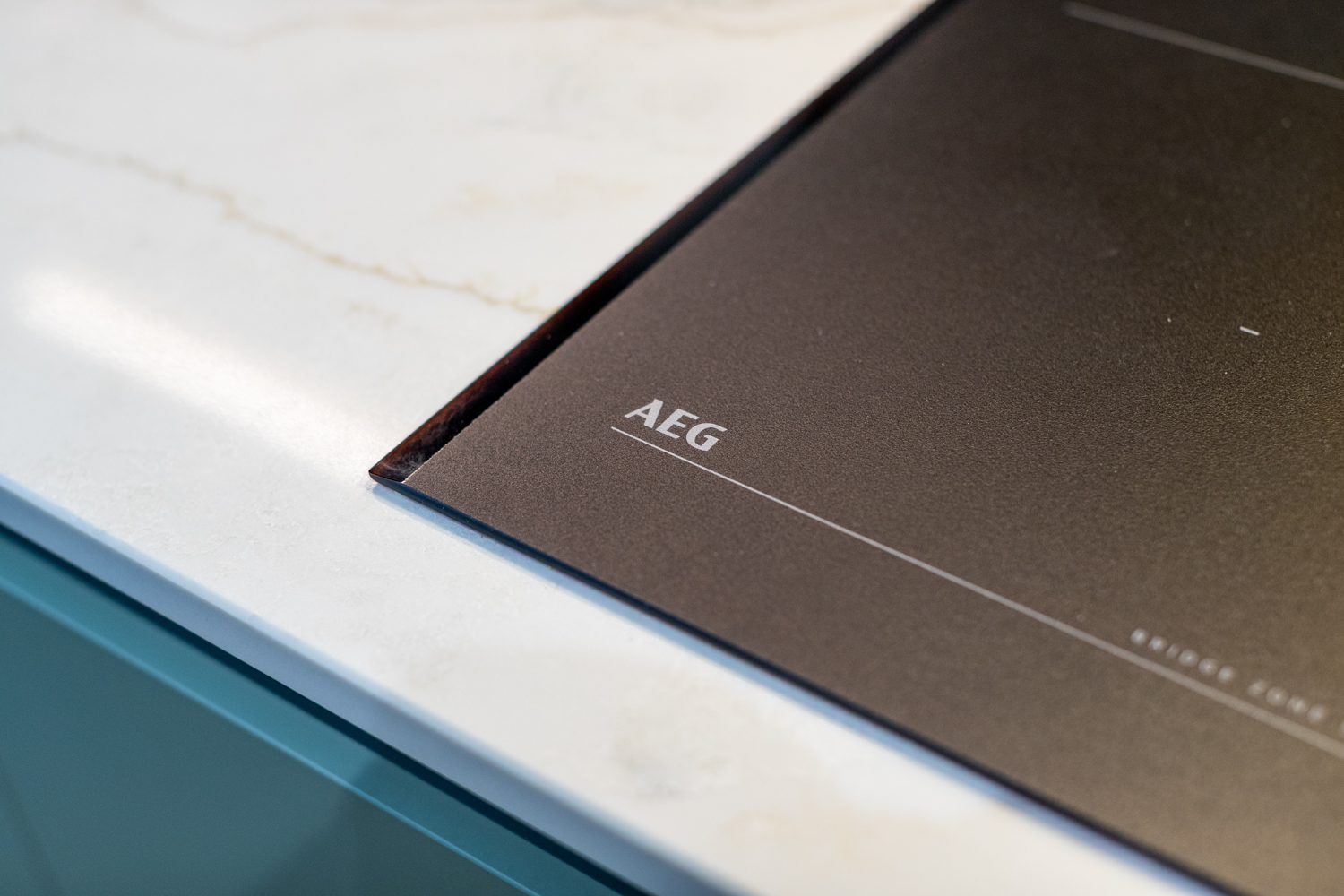 Modern kitchen with handleless design and sleek storage - Atlantis Kitchens