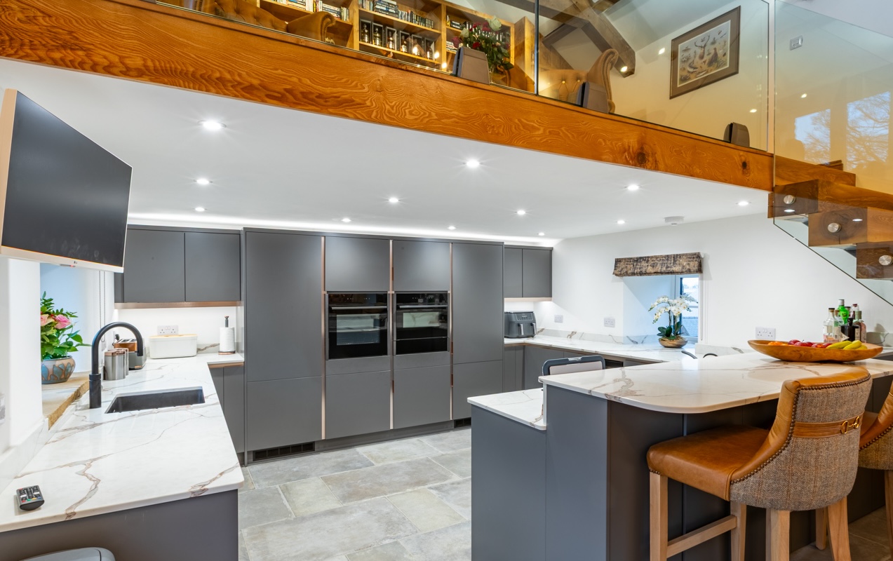 Matt grey kitchen with stepped island